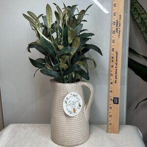 Faux greenery and vase